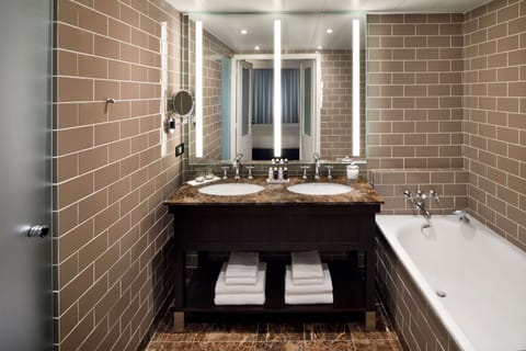 Suite, 1 King Bed (Columbus) | Bathroom | Combined shower/tub, free toiletries, hair dryer, towels