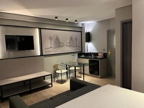 Deluxe Room | Minibar, in-room safe, desk, laptop workspace