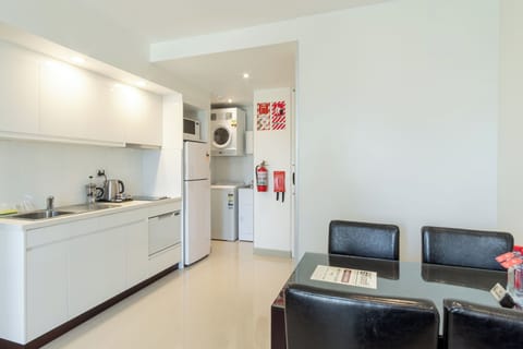 Suite, 2 Bedrooms, Non Smoking, Partial Ocean View | Private kitchen | Full-size fridge, microwave, stovetop, dishwasher