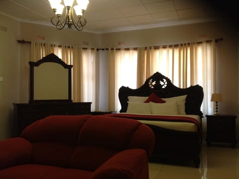 Deluxe Room, 1 King Bed | In-room safe, desk, laptop workspace, rollaway beds