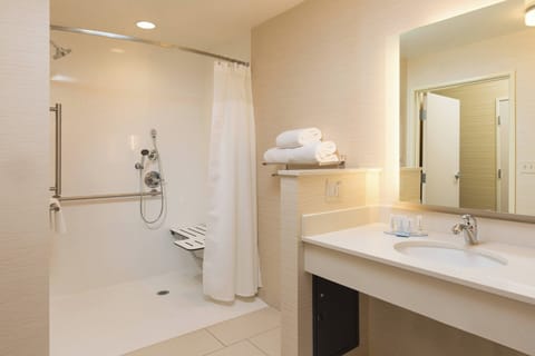 Studio, 1 King Bed (Mobility Accessible, Roll-in Shower) | Bathroom | Combined shower/tub, hair dryer, towels