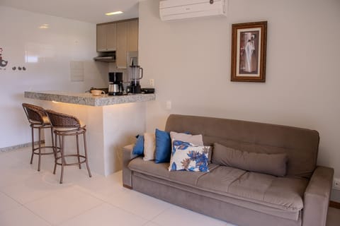 Deluxe Apartment | Living area | 50-inch LED TV with satellite channels, TV