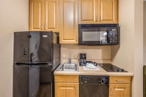 Suite, 1 King Bed, Non Smoking | Private kitchen | Fridge, microwave, oven, stovetop