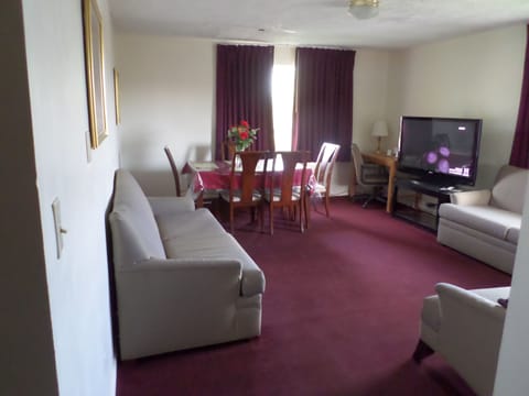 Deluxe Suite, 2 Queen Beds, Kitchen | Living room | TV, Netflix