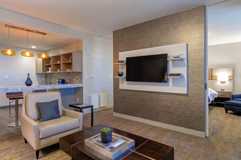 Superior Suite, 1 King Bed | Living room | 50-inch flat-screen TV with cable channels, TV