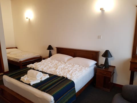 Deluxe Triple Room (AC) | Premium bedding, iron/ironing board, free WiFi