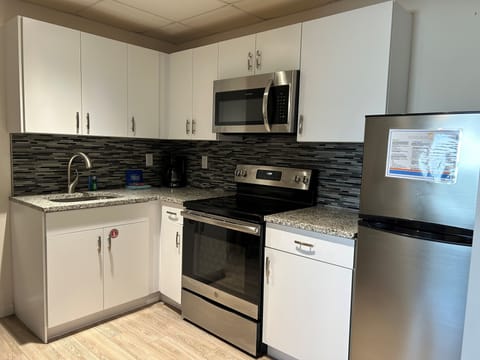 Family Suite | Private kitchen | Microwave, stovetop, coffee/tea maker, toaster