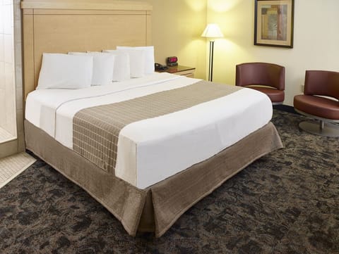 Suite, 1 King Bed, Non Smoking | Premium bedding, pillowtop beds, laptop workspace, iron/ironing board