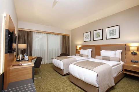 Deluxe Room, City View | Premium bedding, minibar, in-room safe, desk