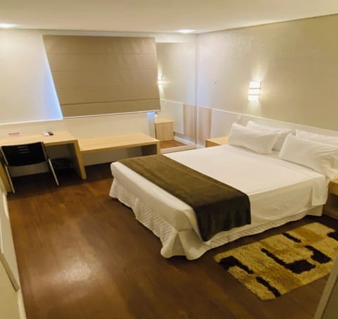 Deluxe Double Room | Minibar, in-room safe, desk, blackout drapes