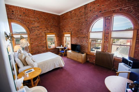 Premium Room, 1 King Bed (Top Floor Corner) | Desk, laptop workspace, iron/ironing board, cribs/infant beds