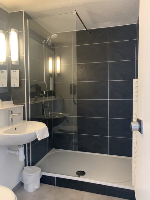 Bathtub, eco-friendly toiletries, hair dryer, towels