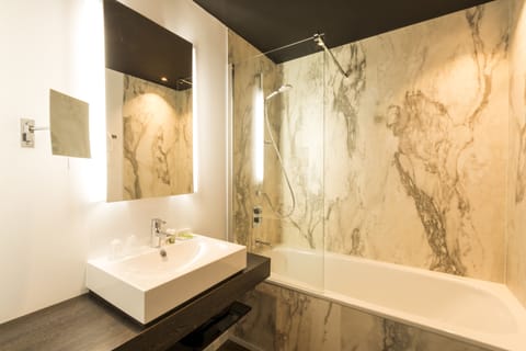 Deep soaking tub, eco-friendly toiletries, hair dryer, towels