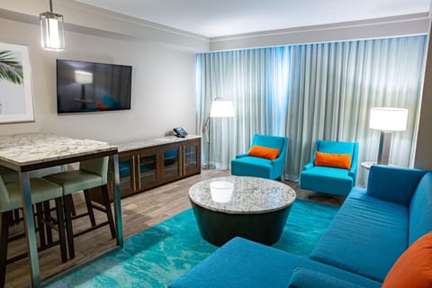 Signature Suite, 1 King Bed | Living area | Flat-screen TV, pay movies
