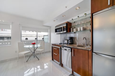 Two Queens Suite Partial Ocean View w/Balcony 1 | Private kitchenette | Full-size fridge, microwave, stovetop, dishwasher