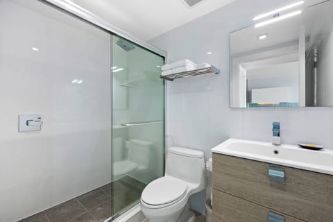 Signature King, One Bedroom Suite | Bathroom | Shower, rainfall showerhead, designer toiletries, hair dryer