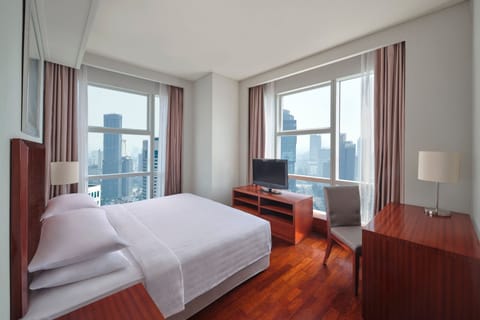 Deluxe Suite, 2 Bedrooms, Smoking, City View (Corner) | Down comforters, minibar, in-room safe, desk