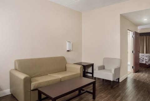 Suite, 1 King Bed, Non Smoking | Desk, blackout drapes, iron/ironing board, free cribs/infant beds