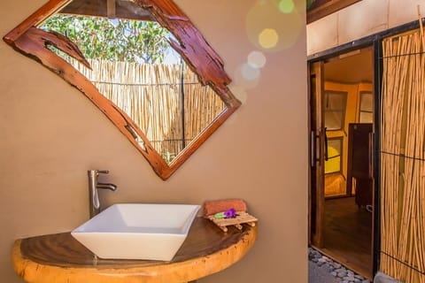 Beachfront Safari Bure | Bathroom | Shower, towels