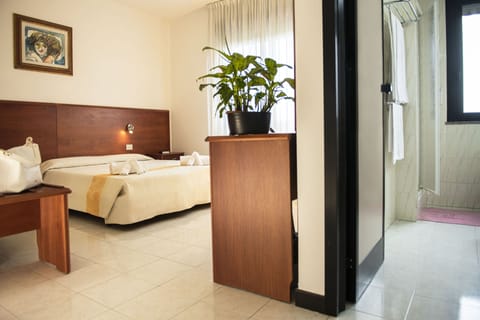 Double or Twin Room | Minibar, in-room safe, desk, blackout drapes