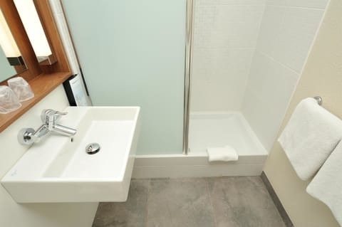 Rainfall showerhead, eco-friendly toiletries, hair dryer, towels