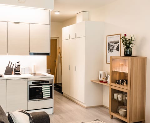 Nordica Design Apartment | Private kitchen | Full-size fridge, microwave, oven, stovetop