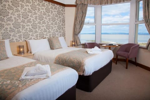 Family Triple Room, Sea View | Desk, iron/ironing board, free WiFi, bed sheets