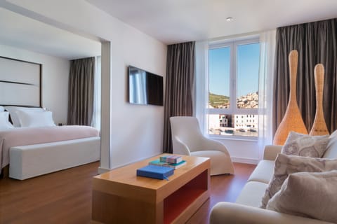 Suite, Sea View | Minibar, in-room safe, desk, free WiFi