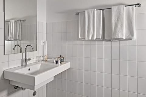 Junior Suite | Bathroom | Shower, designer toiletries, hair dryer, bathrobes