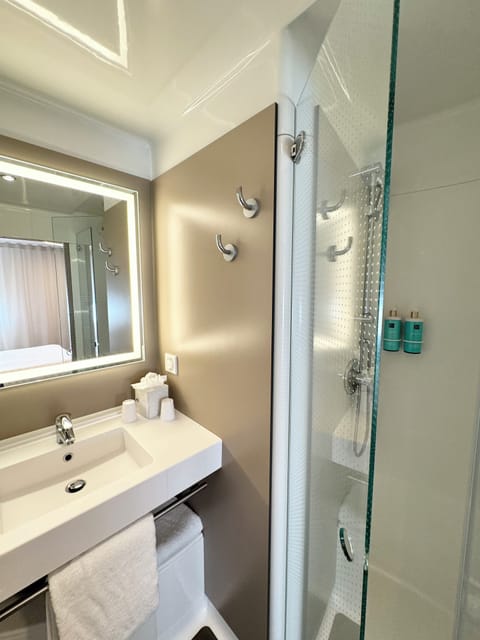 Separate tub and shower, eco-friendly toiletries, hair dryer, towels