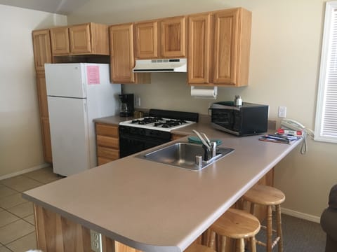 Suite, 2 Bedrooms | Private kitchen | Fridge, microwave, oven, stovetop