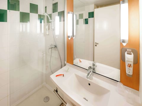 Shower, eco-friendly toiletries, hair dryer, towels