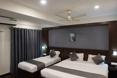 Deluxe Triple Room (Non AC) | Premium bedding, in-room safe, desk, rollaway beds