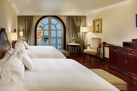 Deluxe Suite, 2 Queen Beds, Courtyard View | Down comforters, in-room safe, individually decorated