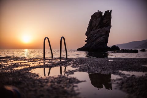 On the beach, sun loungers, beach umbrellas, beach towels