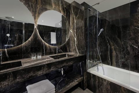 Combined shower/tub, free toiletries, hair dryer, bathrobes