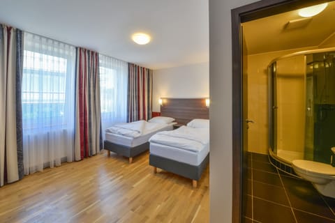 Double or Twin Room | Living area | 85-cm flat-screen TV with satellite channels, TV