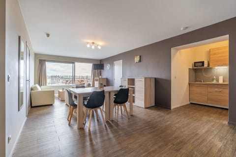 Apartment, 3 Bedrooms | Living area | Flat-screen TV