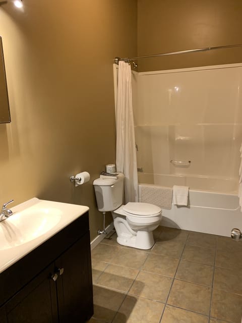 Premium Suite, 1 King Bed, Kitchenette | Bathroom | Combined shower/tub, free toiletries, hair dryer, towels