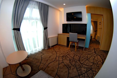 Standard Quadruple Room, 1 Bedroom, Accessible | Minibar, in-room safe, desk, laptop workspace