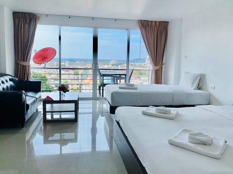 Deluxe Triple Room, Sea View | In-room safe, individually decorated, individually furnished, desk