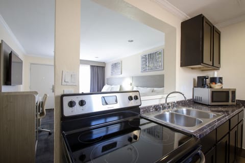 Family Suite, 2 Bedrooms | Private kitchen | Fridge, microwave, coffee/tea maker