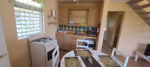 Cottage, 3 Bedrooms | Private kitchen | Full-size fridge, microwave, stovetop, cookware/dishes/utensils