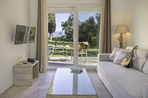 Ianos Garden Suite | Living area | Flat-screen TV