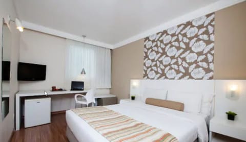 Standard Double Room, 1 Double Bed | Minibar, in-room safe, desk, blackout drapes