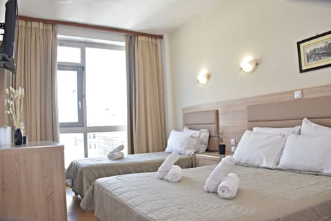 Triple Room | Premium bedding, free minibar items, in-room safe, desk