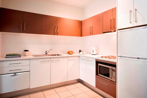 Full-size fridge, microwave, stovetop, coffee/tea maker