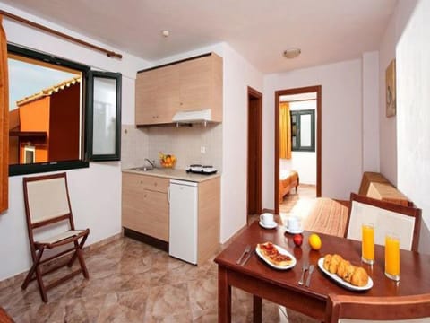 Apartment, 1 Bedroom, Sea View (Quadruple) | Private kitchenette | Fridge, stovetop, electric kettle, cookware/dishes/utensils