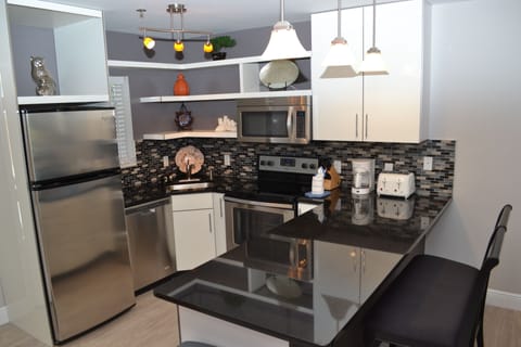 Suite, 2 Bedrooms, Kitchen, Poolside | Private kitchen | Full-size fridge, microwave, oven, stovetop