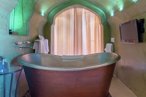 Suite, 1 King Bed | Bathroom | Combined shower/tub, designer toiletries, hair dryer, bathrobes